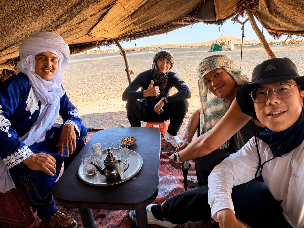 expert guide with travel in nomadic berber camp morocco desert