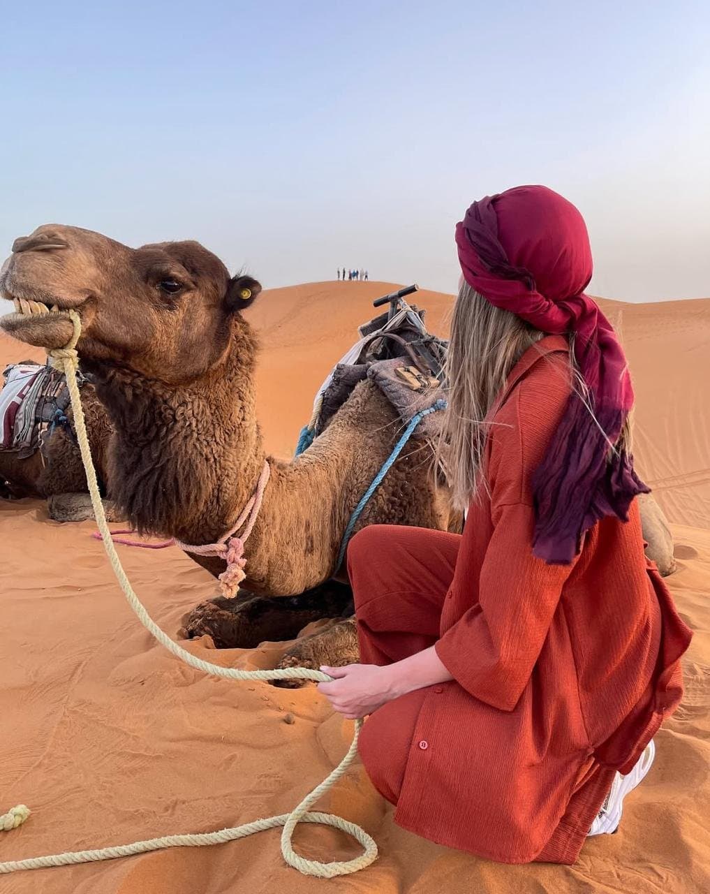 touirst photo with camel in morocco desert